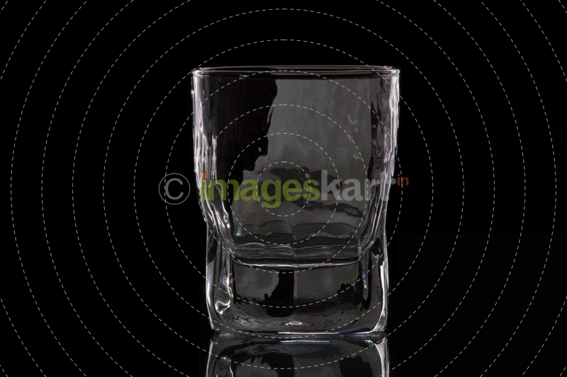 an empty glass of scotch