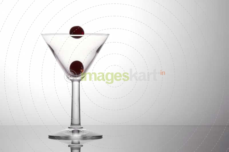 fresh grapes in a cocktail glass isolated on a white background