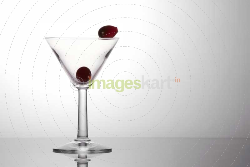 fresh grapes in a cocktail glass isolated on a white background