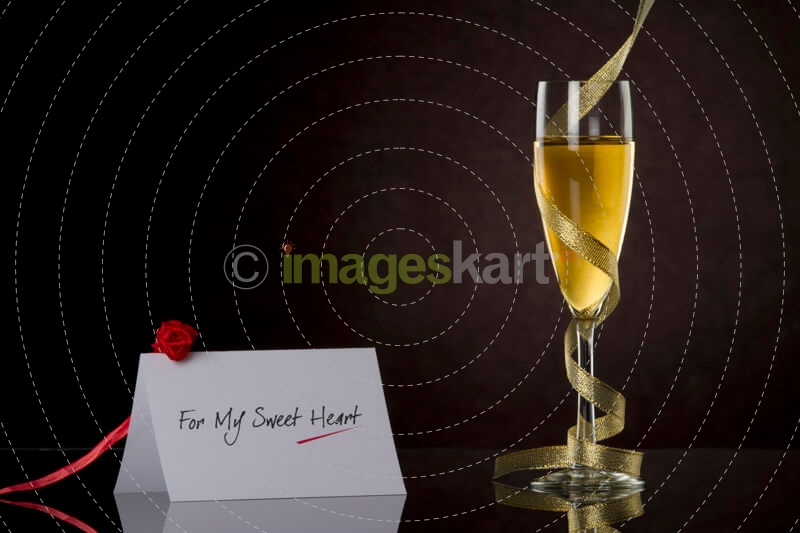 champagne glass with frills and note