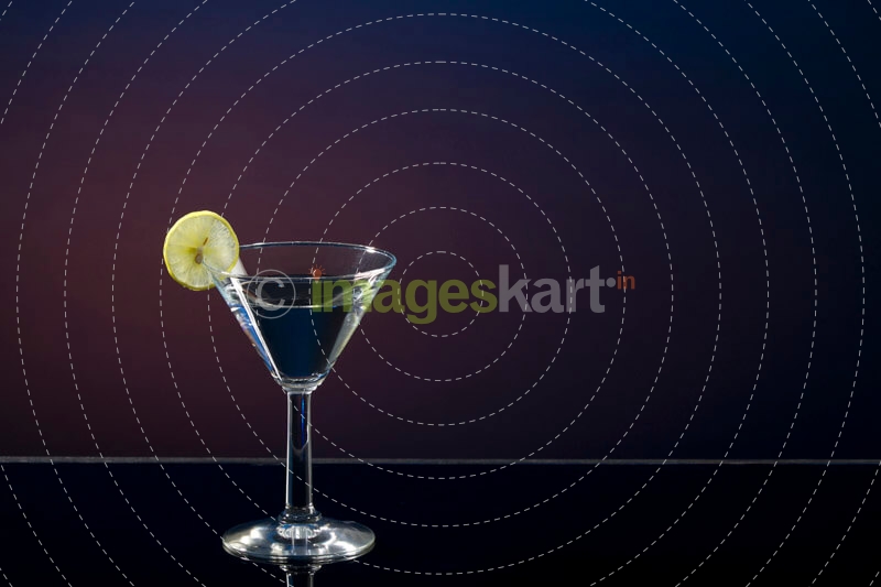 slice of a lemon mint on a martini