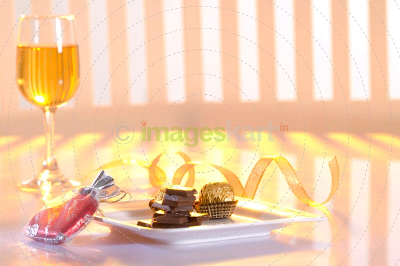 close-up on champagne with chocolate bars on a plate