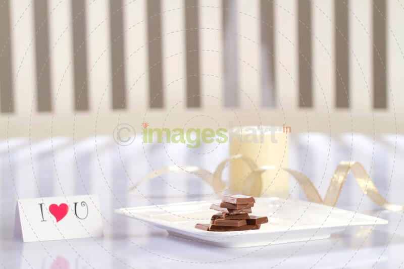 love message with chocolates and candles