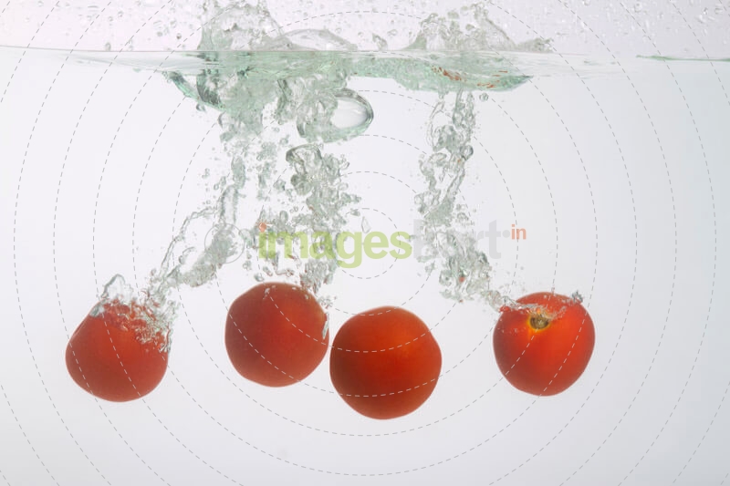 tomatoes splashed in water