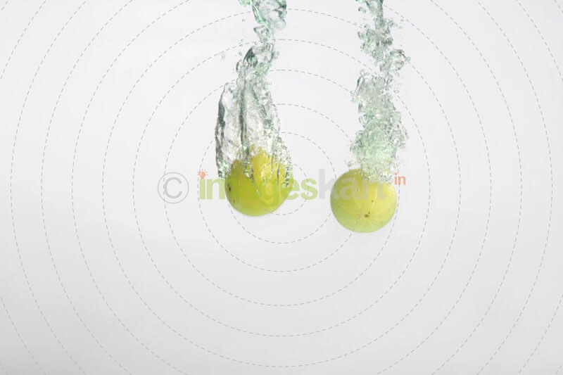 lemon in water forming an abstract art 