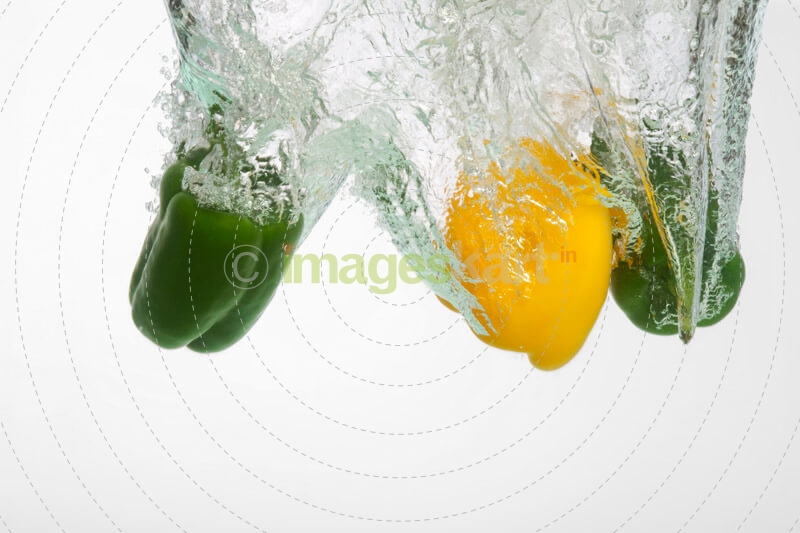 fresh capsicums dropped in water