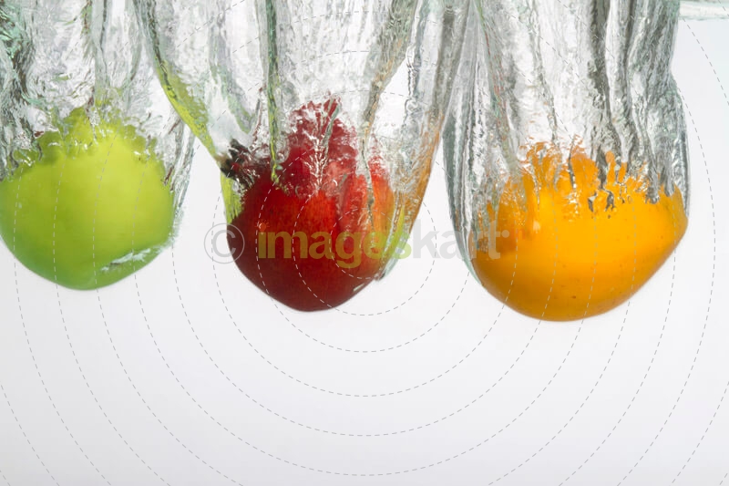 fruits in water against white background 