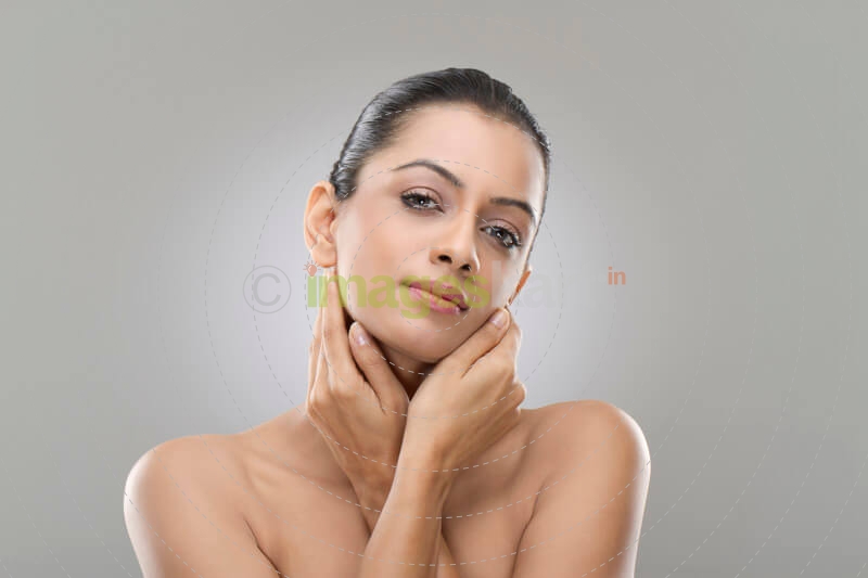 beautiful woman with hands on her face