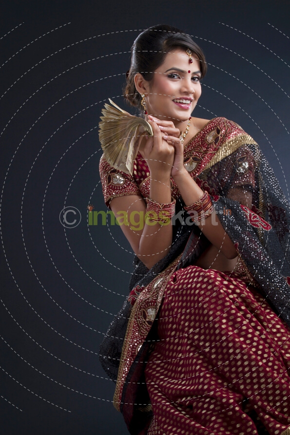 indian woman with stack of notes