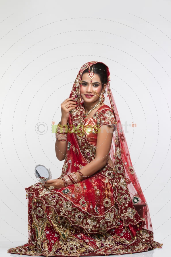 indian bride posing in bridal wear