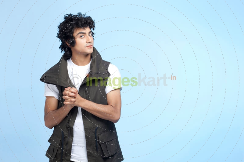 young boy wearing half jacket and posing