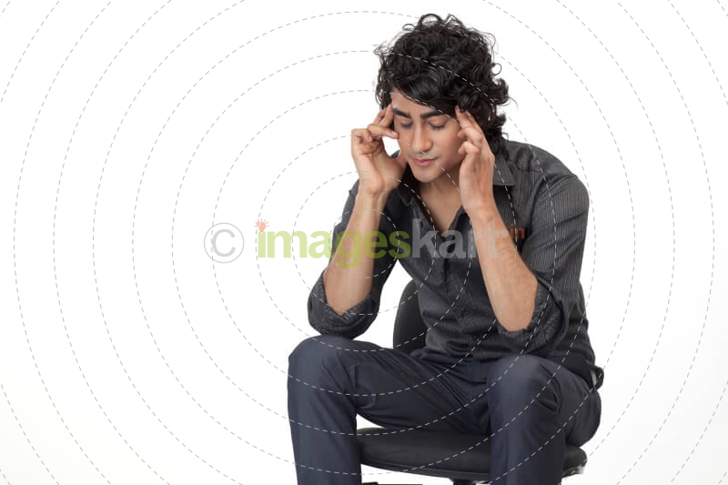 a man sitting on chair in depression 