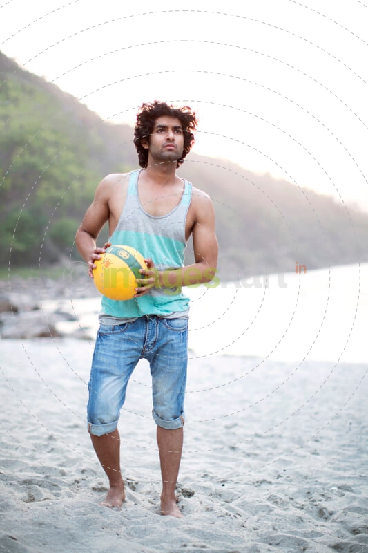 man holding a volley ball