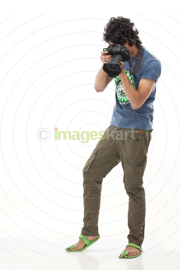 boy with curly hair aiming for a sensitive shot