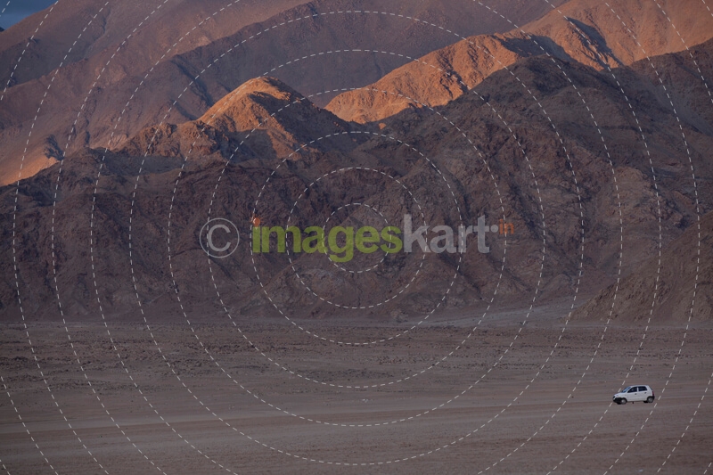 vehicle driving through a beautiful mountain landscape