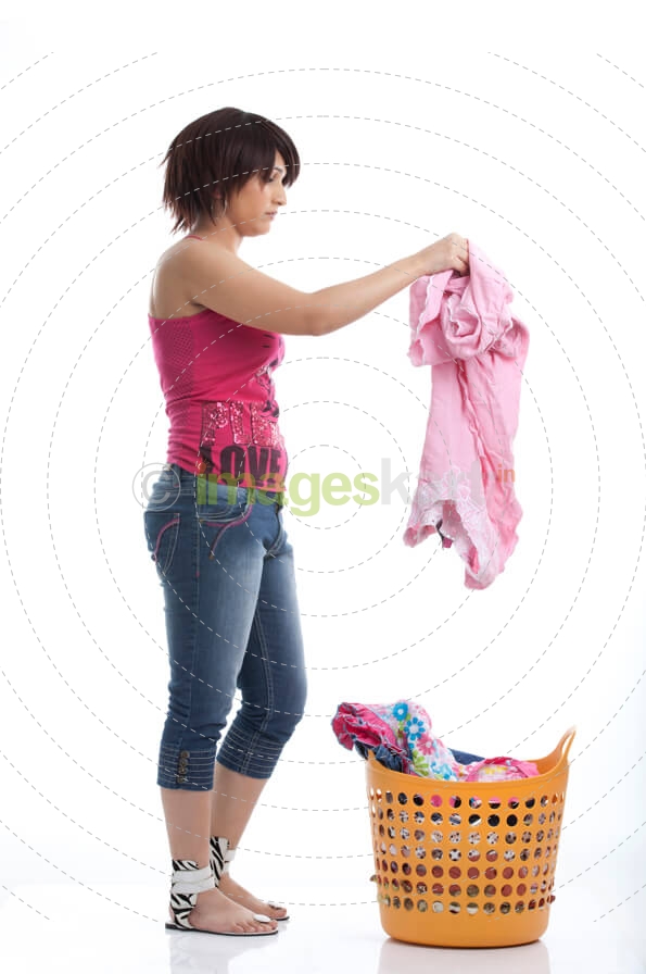 woman picking up clothes to wash
