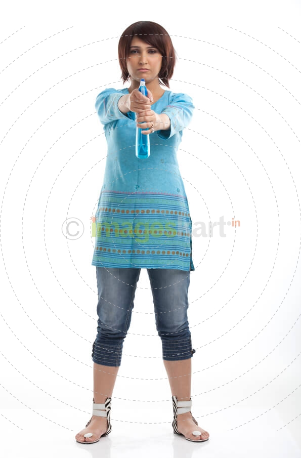 woman with a serious face holding spray bottle