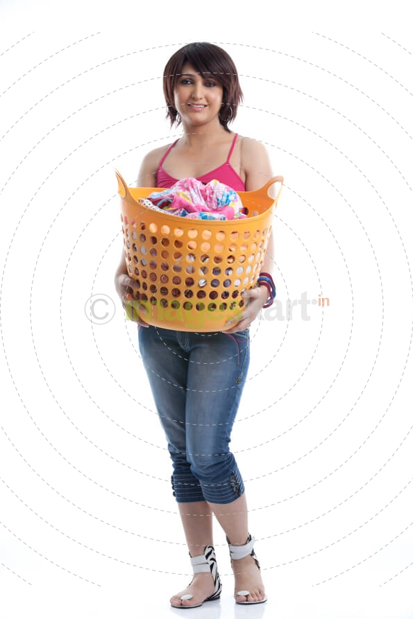 housewife standing with a laundry basket