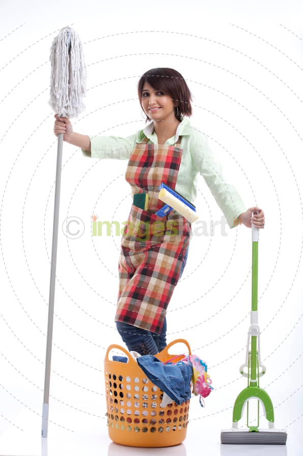 woman showing mop and vacuum