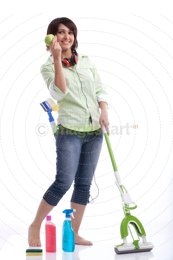 woman showing an apple to the camera while working