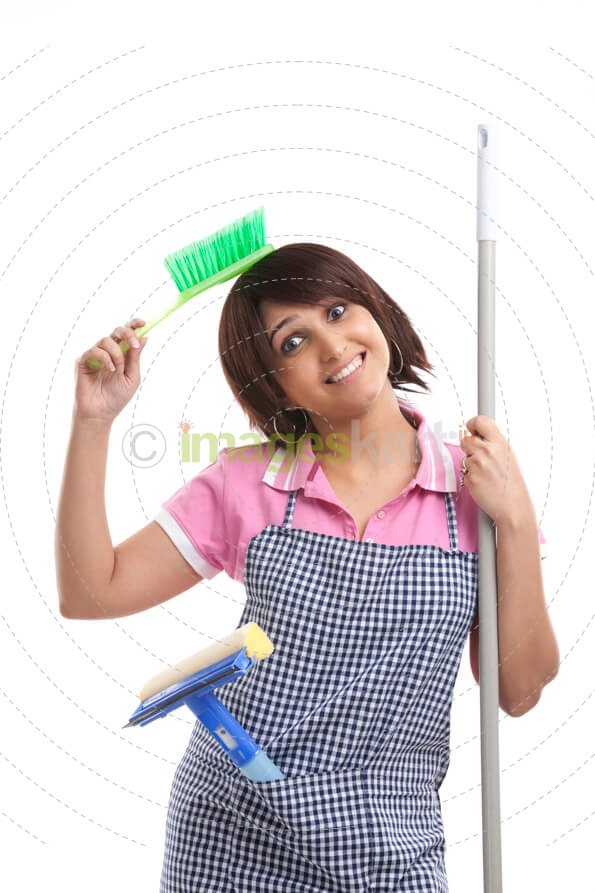 housewife holding a mop and brush