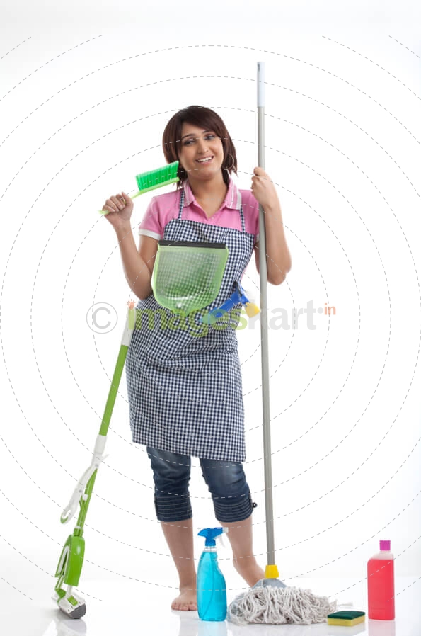 housewife wearing cleaning uniform smiling against white background