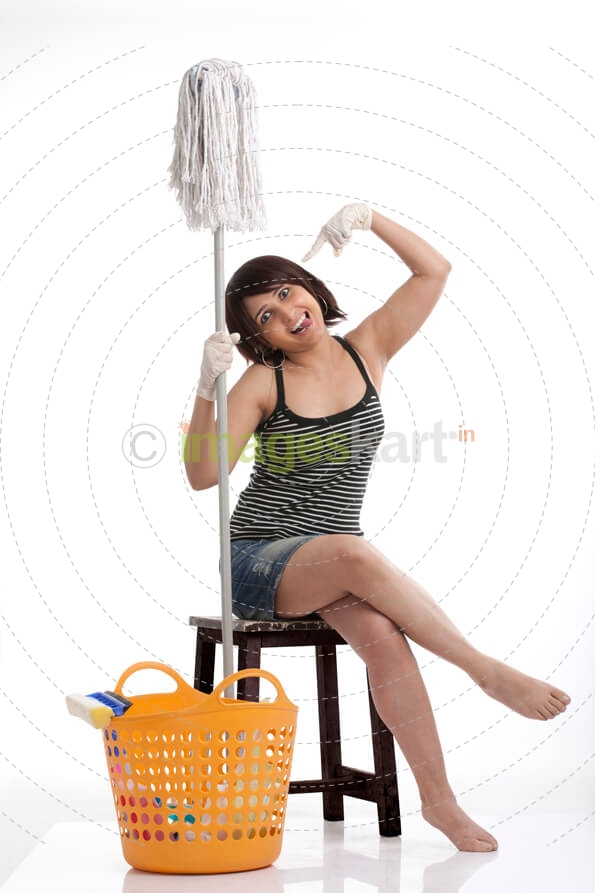 woman posing with funny expressions with a cleaning mop