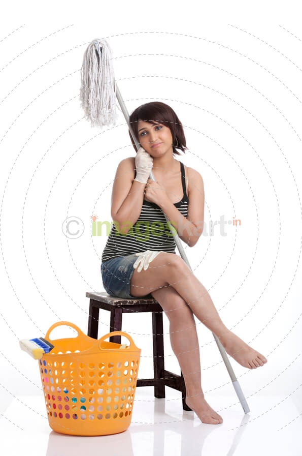 young housewife sitting on a table with a mop