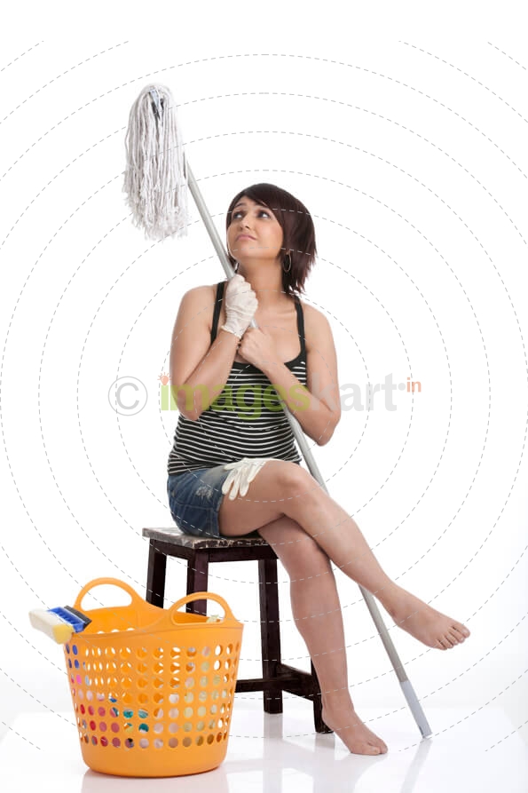 tired woman looking at the mop