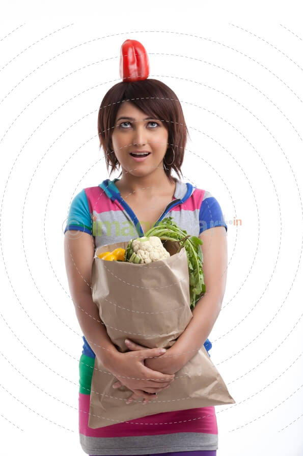 woman with red capsicum on her head