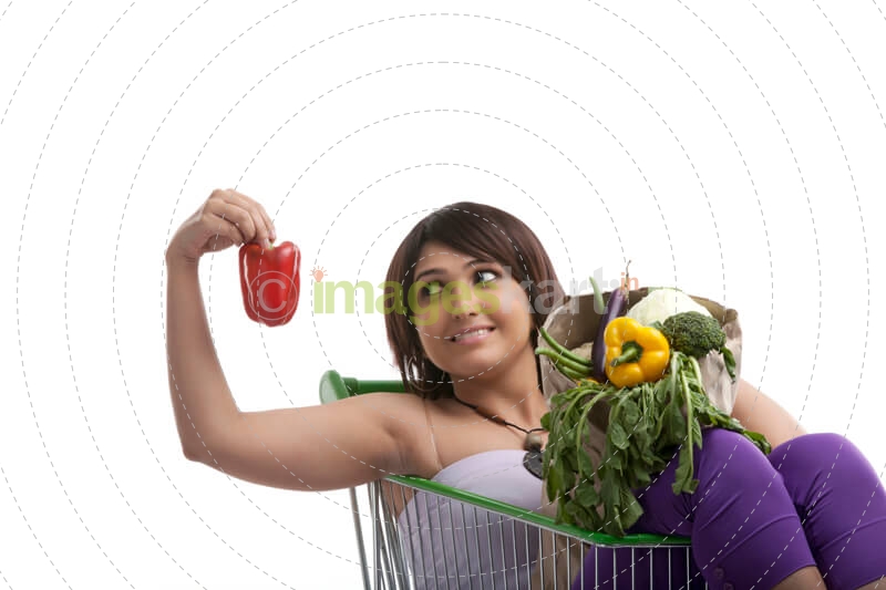 housewife picking up capsicum