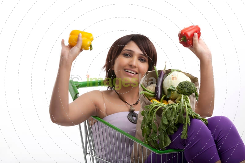 women with bag of vegetables