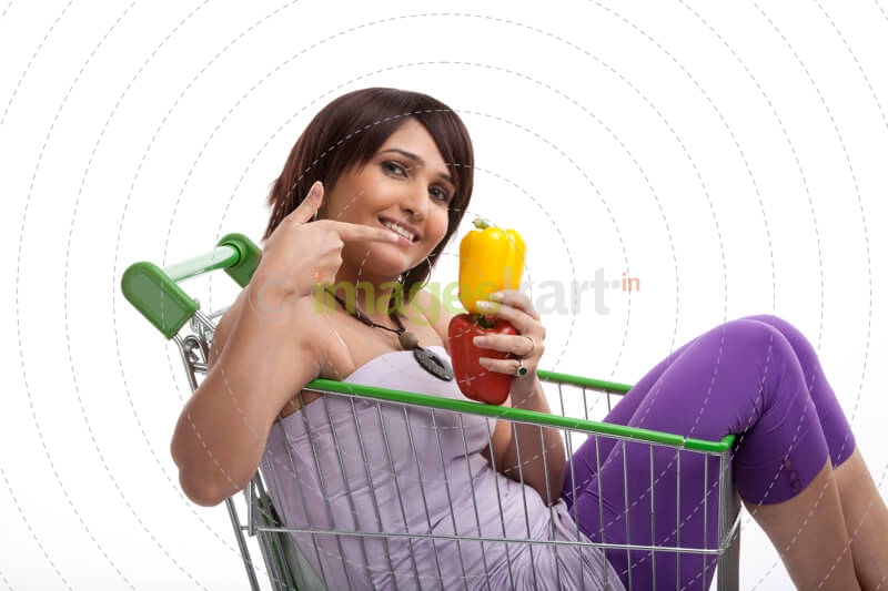 women pointing to the vegetables