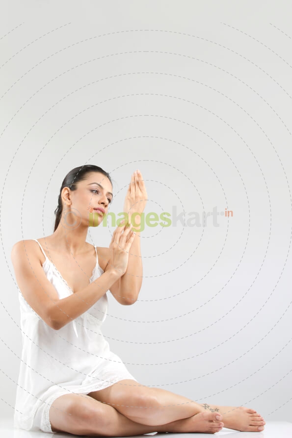 girl looking at her skin 