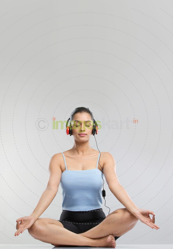 girl meditating with headphones on