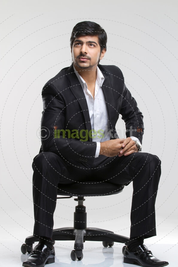 businessman posing while thinking 
