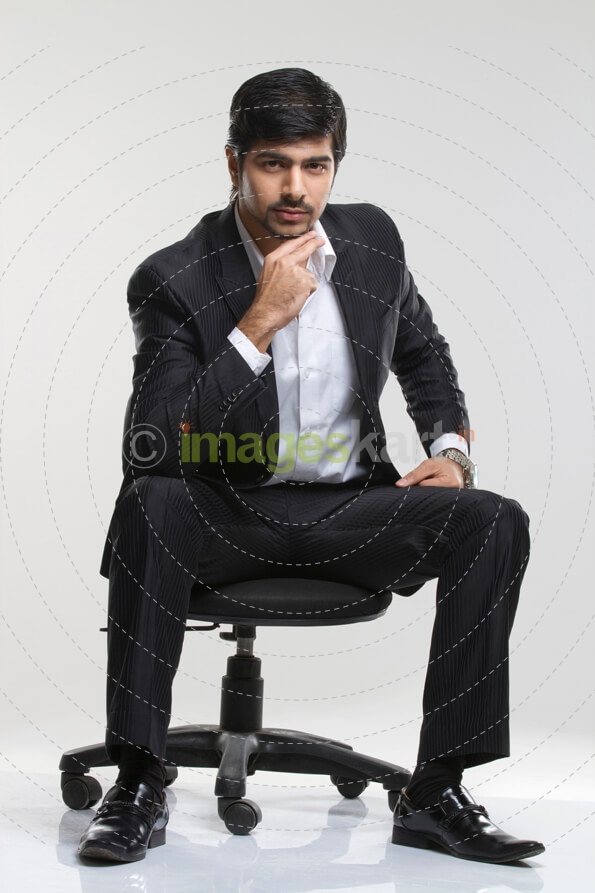 smart male executive posing in suit