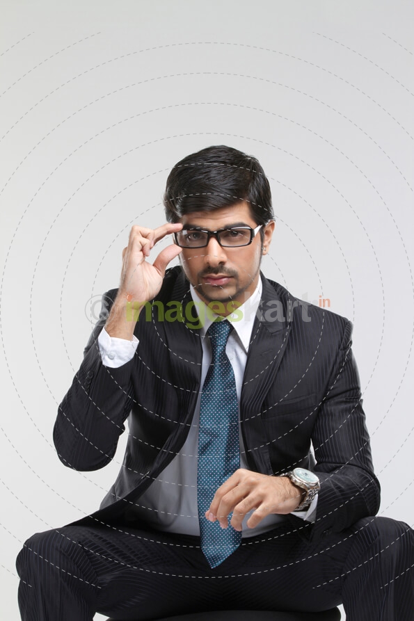 man on chair posing for the camera 