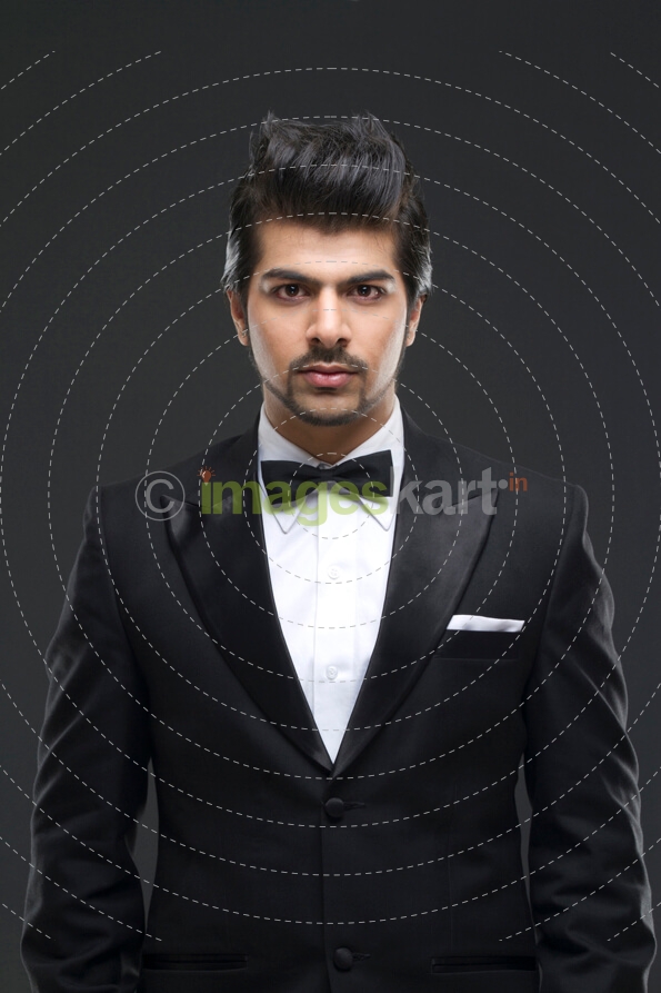 well dressed male model in a black suit
