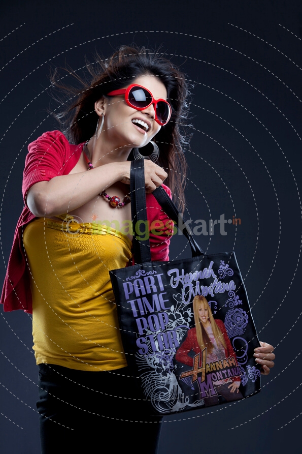stylish young female carrying a handbag