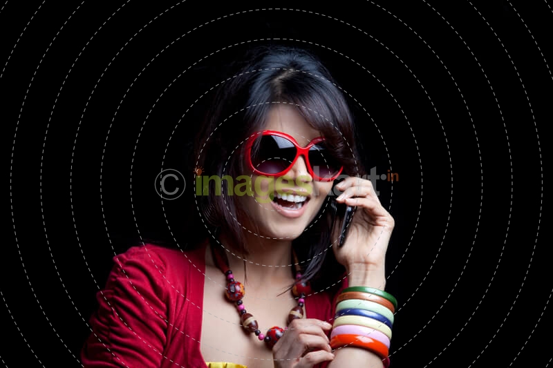 girl wearing shades talking on mobile phone