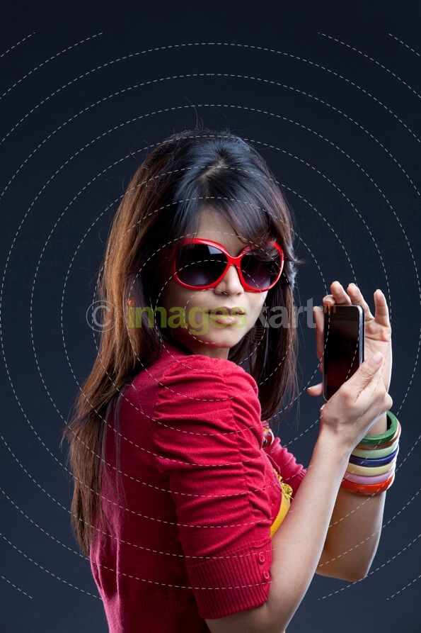 young female posing with mobile phone 