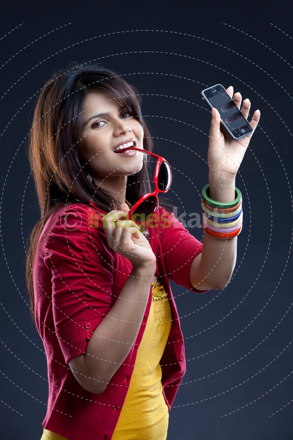 trendy girl posing with mobile phone
