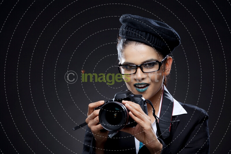 woman holding a dslr
