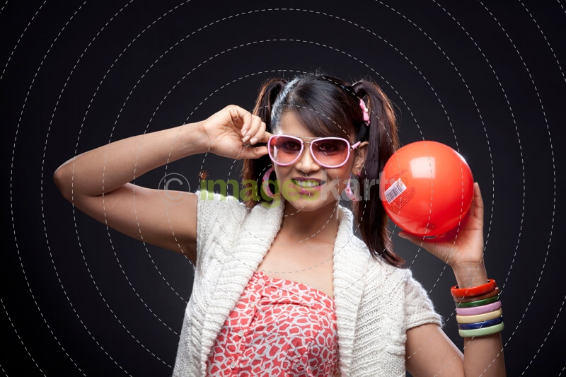 stylish woman posing with red ball with barcode