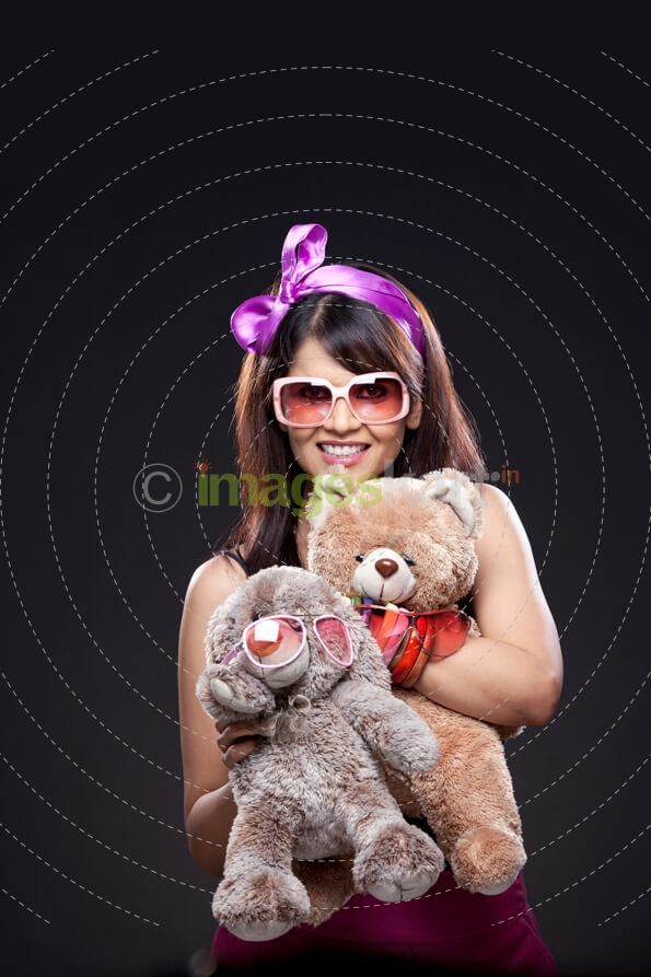 young gir;l with stuff toys
