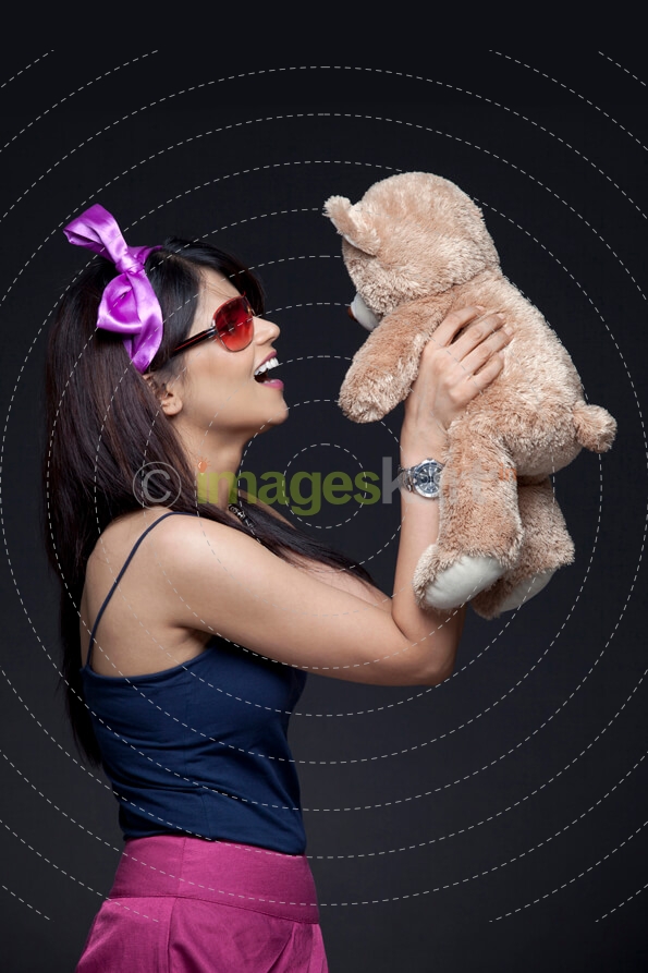 woman lifting her stuff toy
