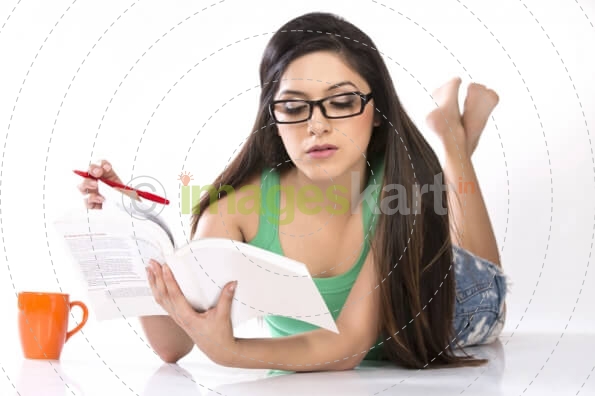 girl posing while reading book 