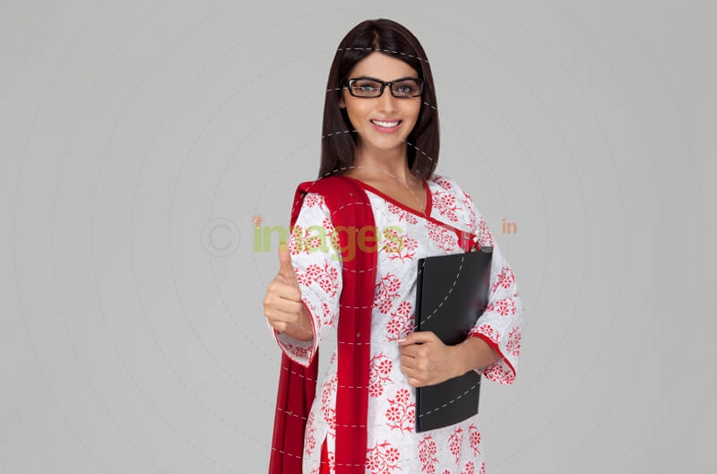 teacher showing thumps up while posing
