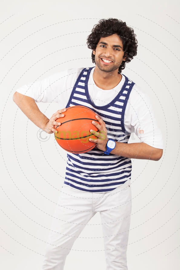 guy pressing basketball with both hands 